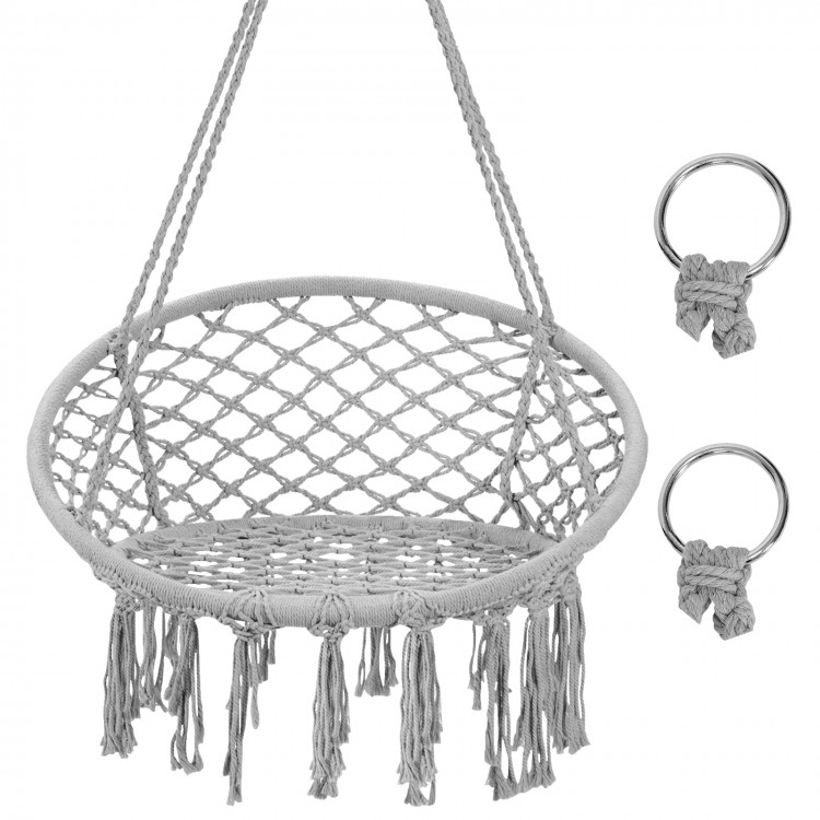 Handwoven gray macrame hammock chair with fringe tassels, durable cotton, and heavy-duty metal frame for indoor or.