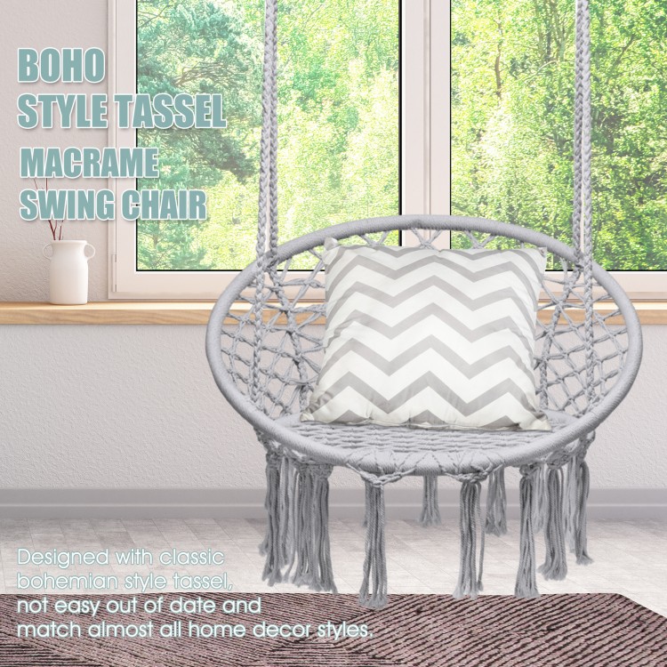 Macrame swing chair in gray with tassels, featuring a handwoven cotton backrest for indoor and outdoor relaxation.