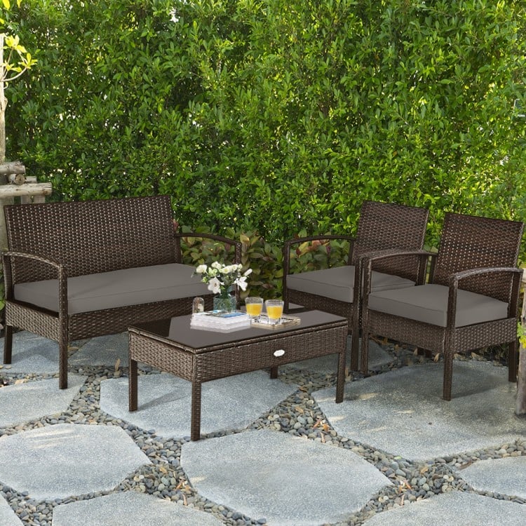 Side view of the patio rattan furniture set with two single chairs and a coffee table, featuring soft cushions for.