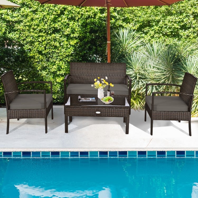 Versatile arrangement of the 4-piece patio rattan furniture set by the pool, featuring a loveseat, two chairs, and a.