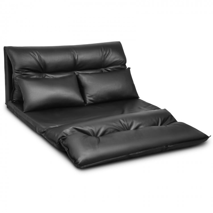 Foldable black PU leather leisure sofa bed with two pillows, adjustable backrest for versatile seating and relaxation.