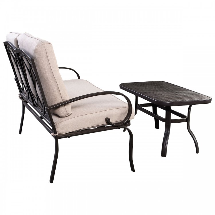 Loveseat with beige cushions and a coffee table, featuring a durable steel frame for outdoor patio use.