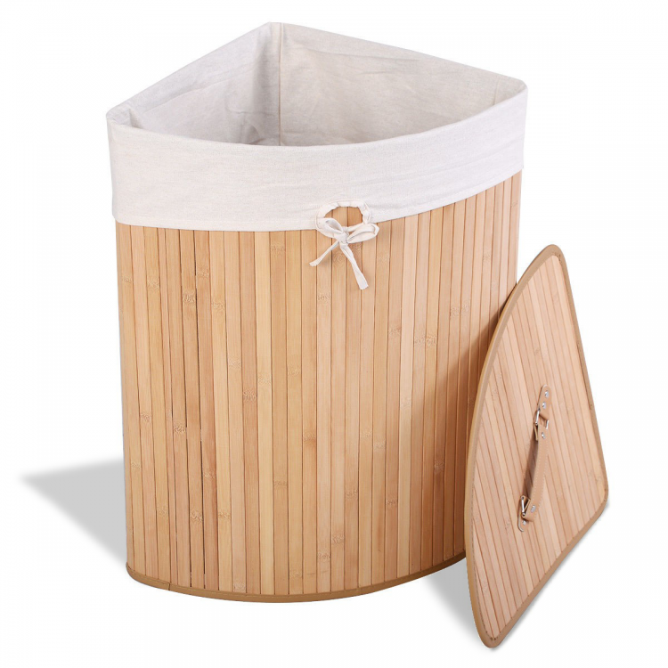 Corner bamboo laundry hamper with a removable liner and PU leather handles for easy transport and odor prevention.