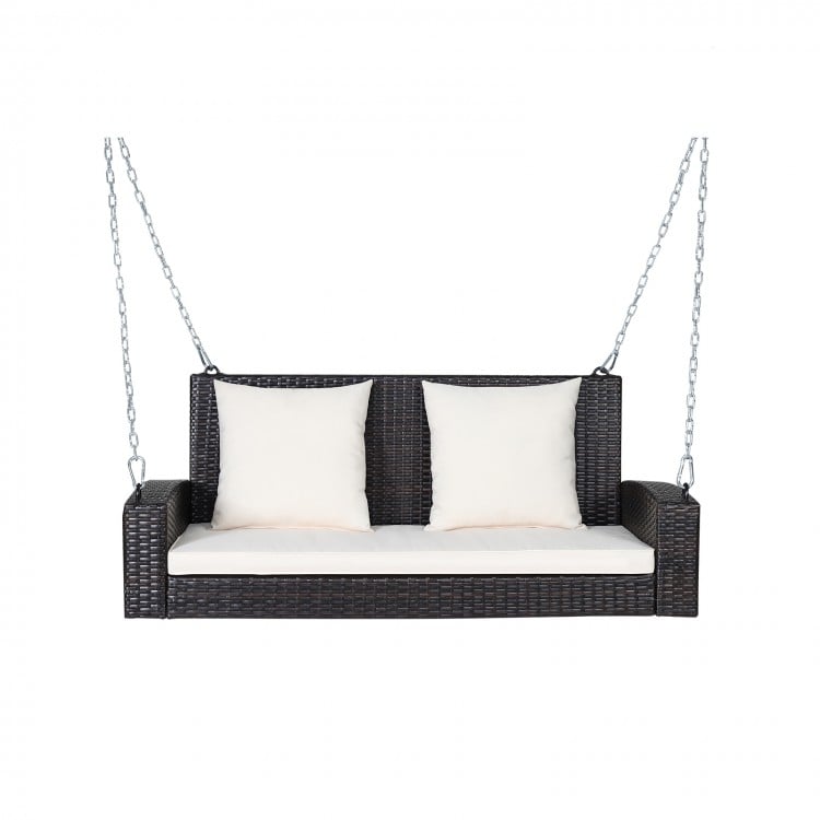 2-person patio rattan porch swing with white cushions, featuring solid steel chains for stability and comfort.