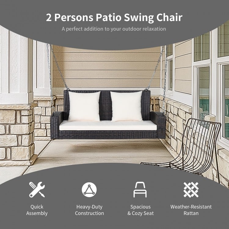 2-person patio rattan swing chair with white cushions, featuring weather-resistant material for outdoor relaxation.