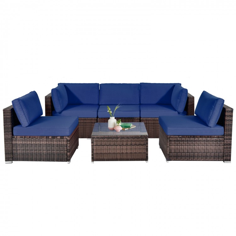 6-piece patio rattan furniture set with navy cushions and glass coffee table, ideal for outdoor relaxation.