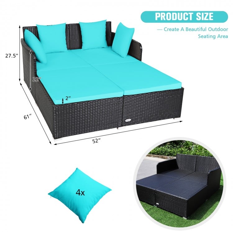 Spacious outdoor rattan daybed with turquoise upholstered cushions and pillows, designed for comfort and durability.
