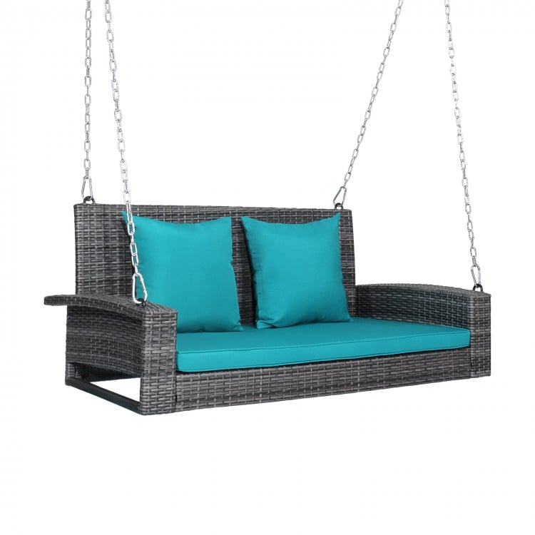 Turquoise cushion detail on a 2-person patio PE wicker hanging swing bench with plush padding and removable cover.