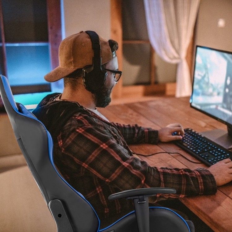 Massage gaming chair in blue from a side view, featuring a lumbar pillow and adjustable backrest for enhanced comfort.
