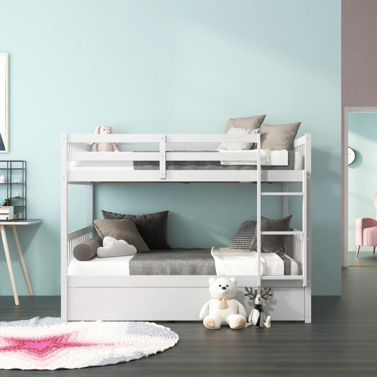 Full over full bunk bed in white wood with trundle, featuring modern design and sturdy pine frame for kids' rooms.