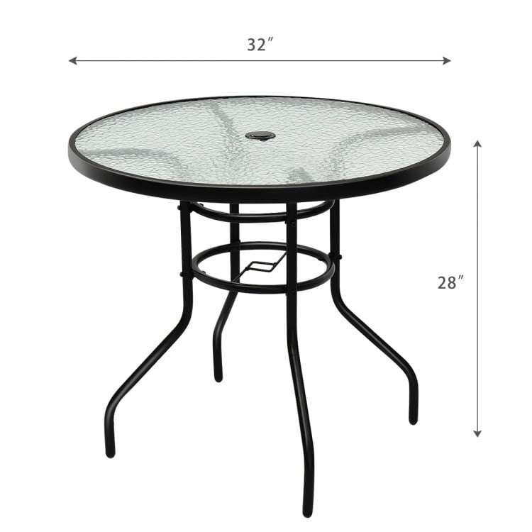 Round 32-inch patio table with tempered glass top and black steel frame, featuring an umbrella hole for outdoor use.