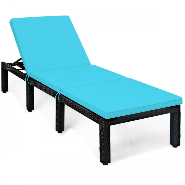 Height adjustable rattan lounge chair in blue with soft cushion, ideal for patio or poolside relaxation.