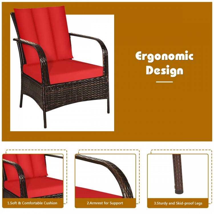 Red cushioned rattan chair with curved armrests, made of weather-resistant materials for outdoor patio relaxation.