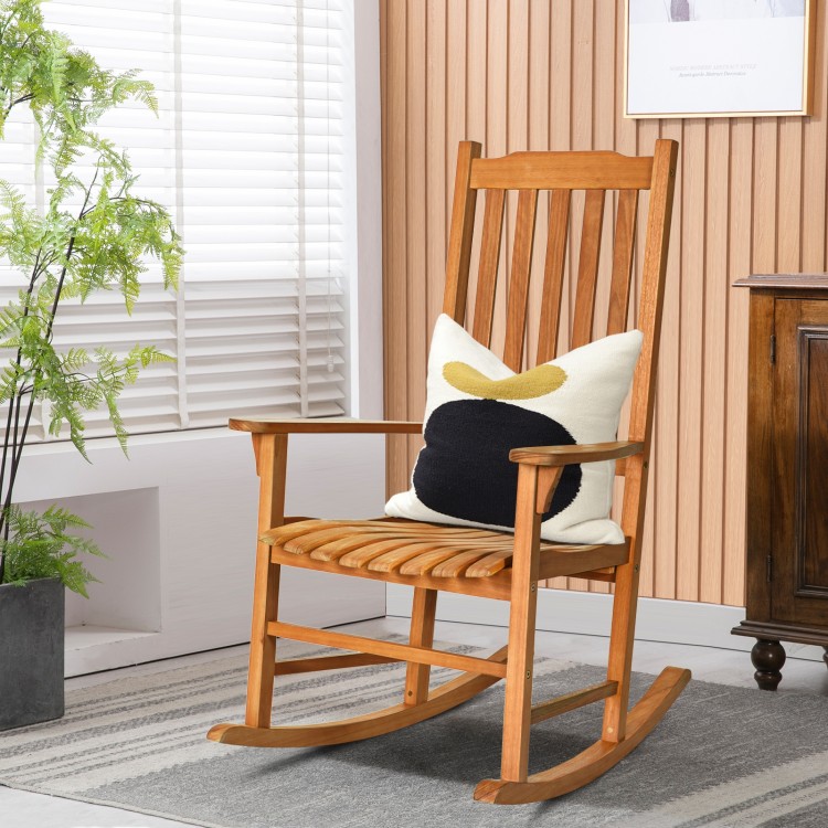 Eucalyptus wood outdoor rocking chair with slatted seat and widened armrests, perfect for patio relaxation.