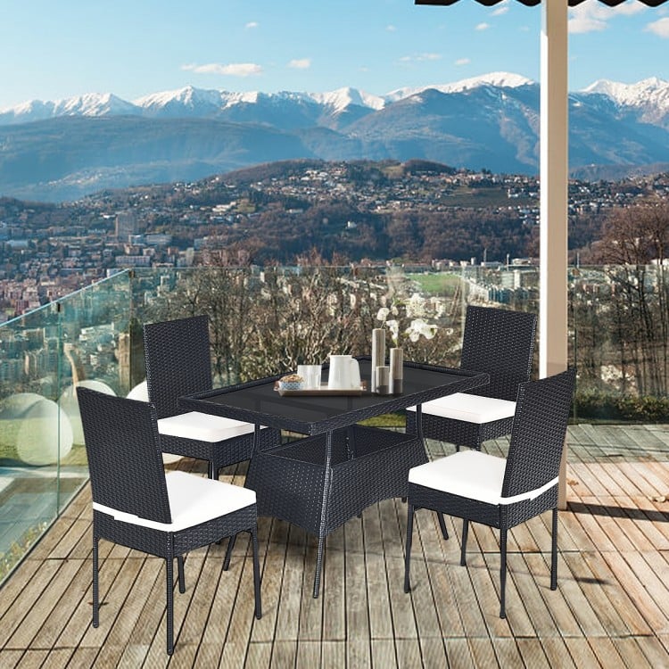 5-piece outdoor patio rattan dining set with glass top and cushions, perfect for family gatherings on the balcony.