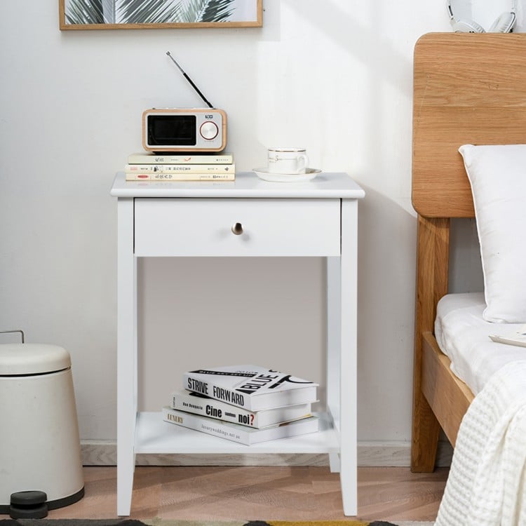 White wooden bedside table featuring a spacious tabletop, drawer, and open shelf for convenient storage in any room.