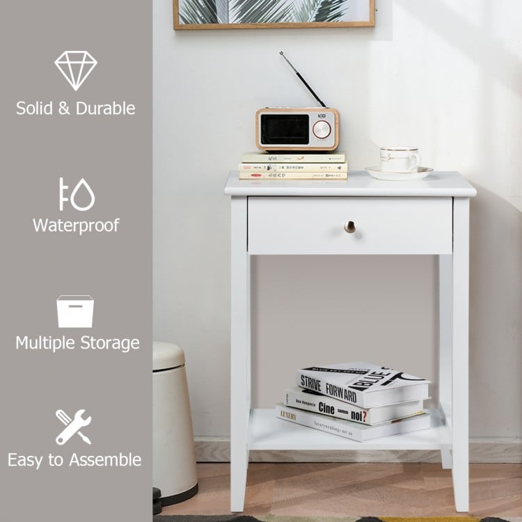 White bedside table showcasing a pull-out drawer, smooth lacquered surface, and solid pine wood legs for enhanced.