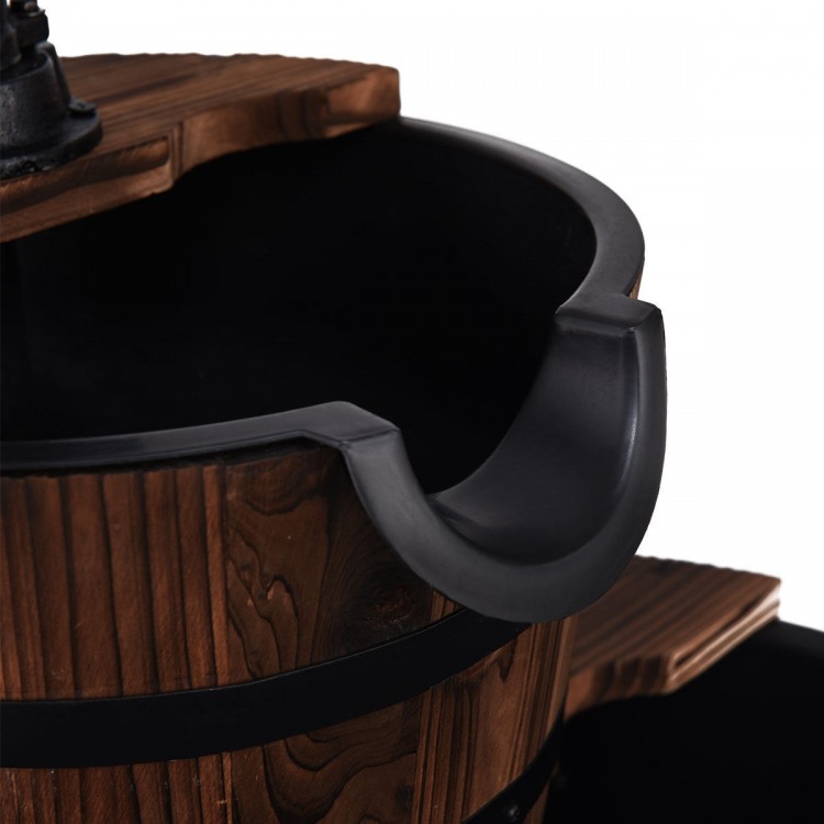 Close-up of the 2-tier outdoor wooden barrel fountain showcasing the smooth carbonized wood and decorative hand pump.