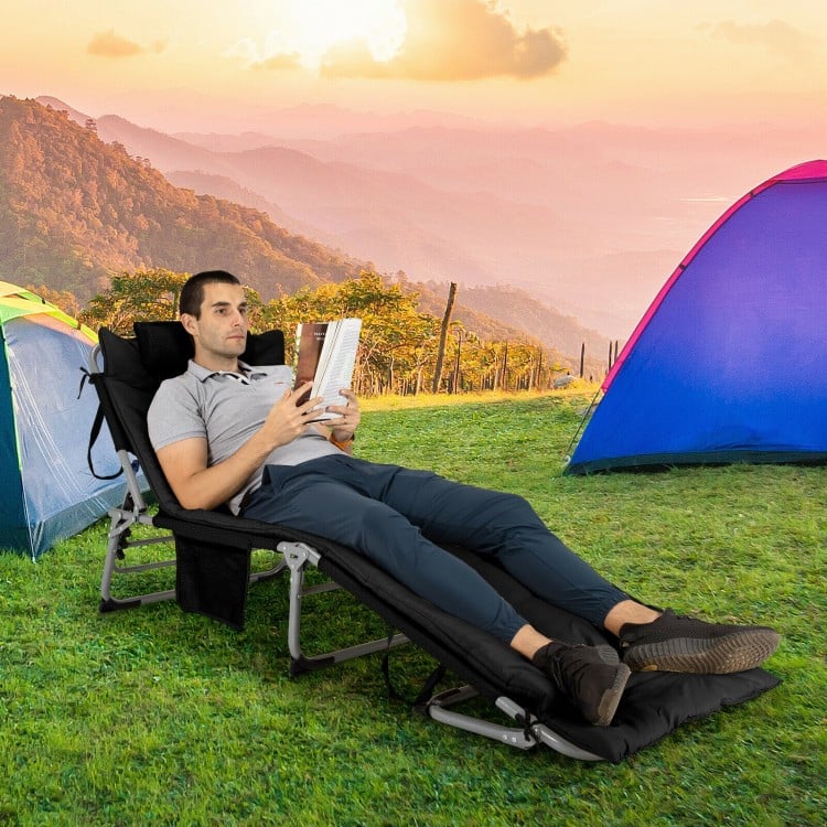 Oversize padded folding lounge chair in black with removable mattress, perfect for outdoor relaxation and easy storage.
