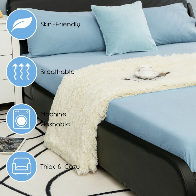 Double-sided throw blanket in beige, featuring shaggy fur and smooth velvet, perfect for cozying up on a sofa or bed.