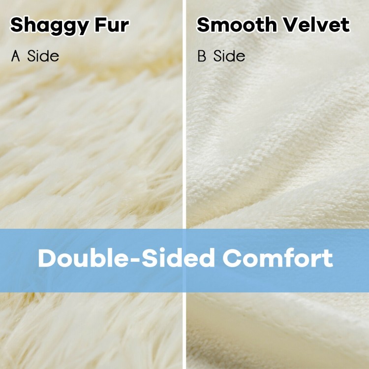 Double-sided throw blanket featuring shaggy fur and smooth velvet, 88 x 77 inches, perfect for cozying up on the sofa.