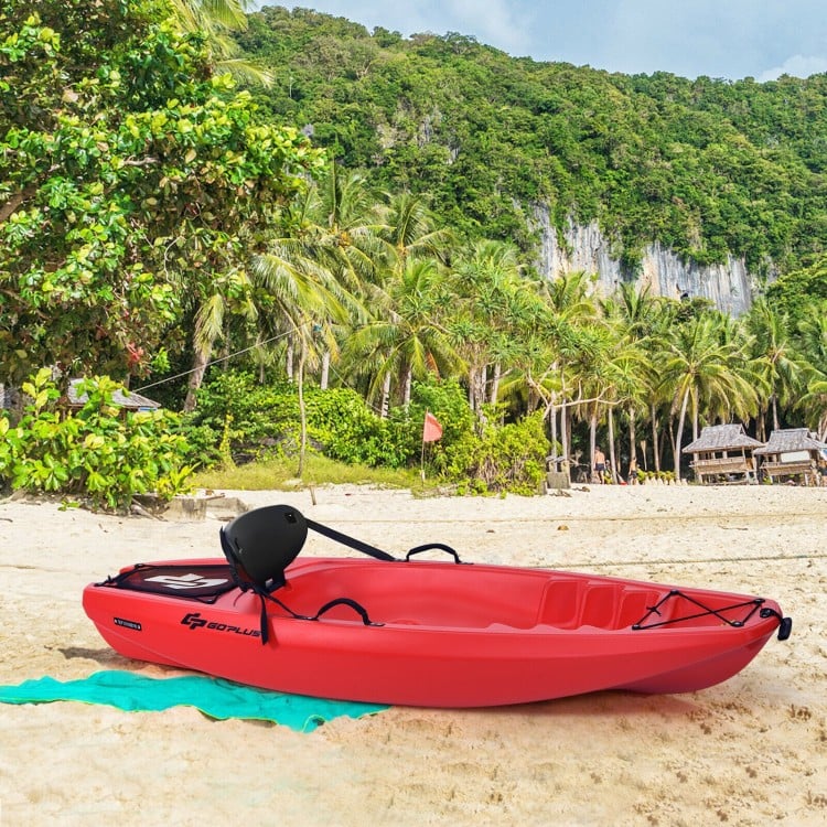 Red 6-foot youth kayak with folding backrest and paddle, perfect for kids over 5, set on a sandy beach.