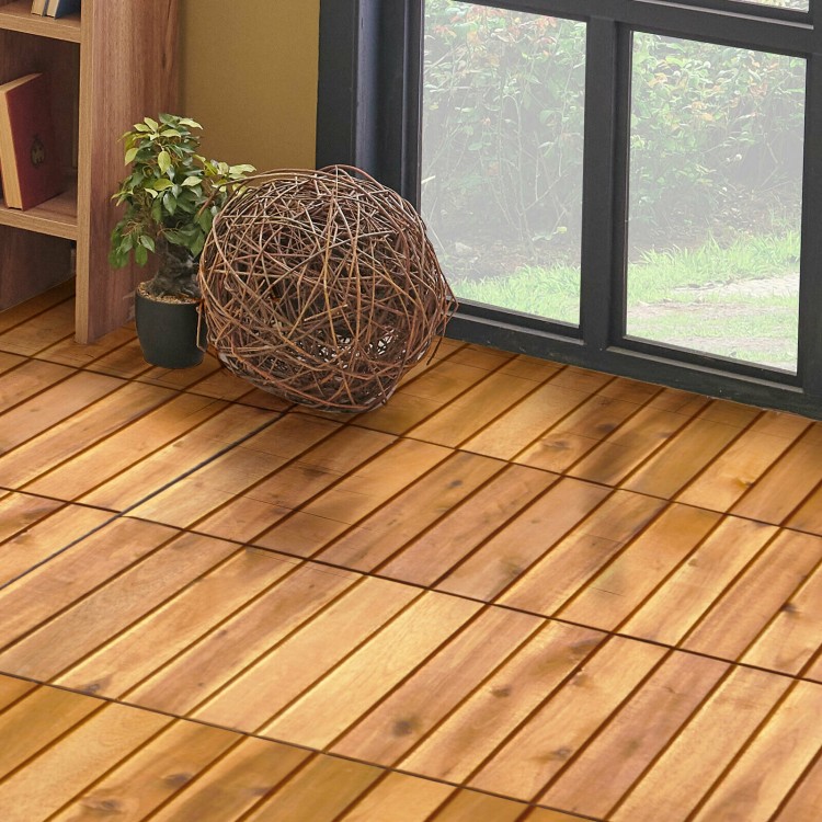 Interlocking acacia wood patio deck tiles arranged on a wooden floor, perfect for indoor and outdoor spaces.