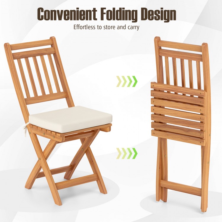 Patio folding chair set of 2 in natural acacia wood with soft seat cushions, ideal for backyard and poolside use.
