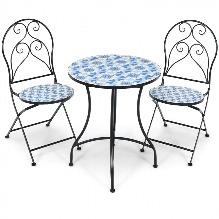 Two folding bistro chairs with blue floral mosaic pattern and a round table, perfect for outdoor patio relaxation.