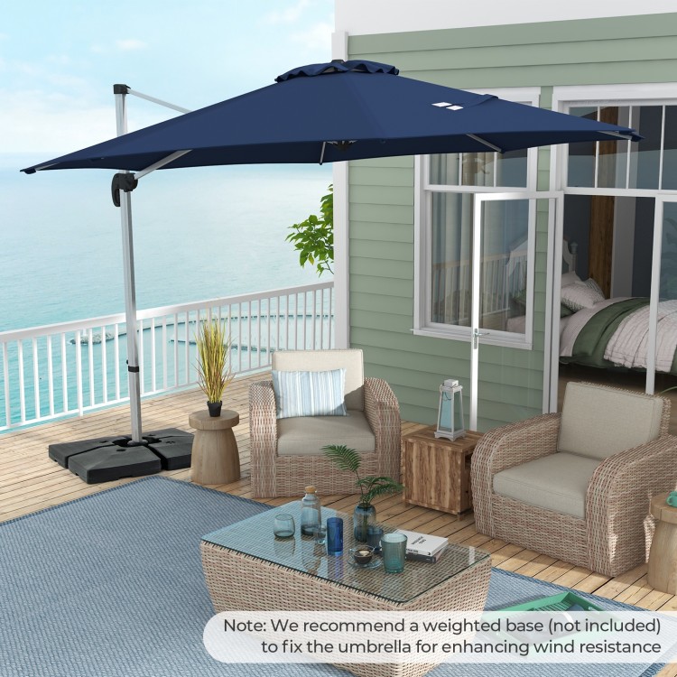 Navy 11 ft outdoor patio umbrella with 360° rotation and adjustable tilt, ideal for sun protection on a balcony.