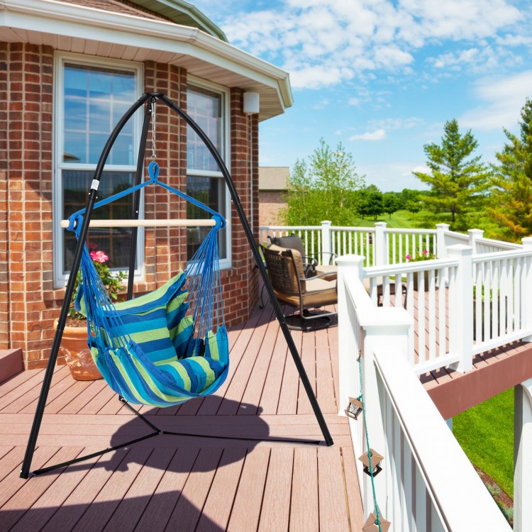 Black heavy-duty metal hanging chair stand with a striped hammock, ideal for outdoor relaxation on a sunny deck.