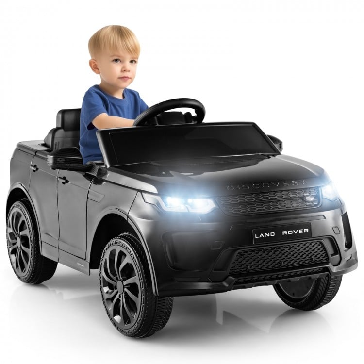 Kids ride-on car in black with realistic features, remote control, and LED lights for safe outdoor fun.