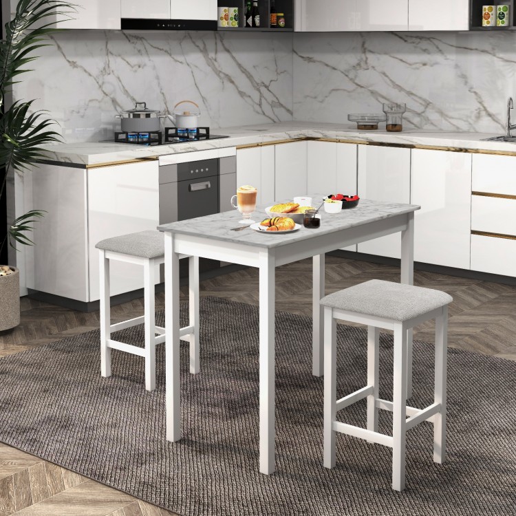 3-piece bar table set with faux marble tabletop and two padded stools, ideal for dining or breakfast in a modern.