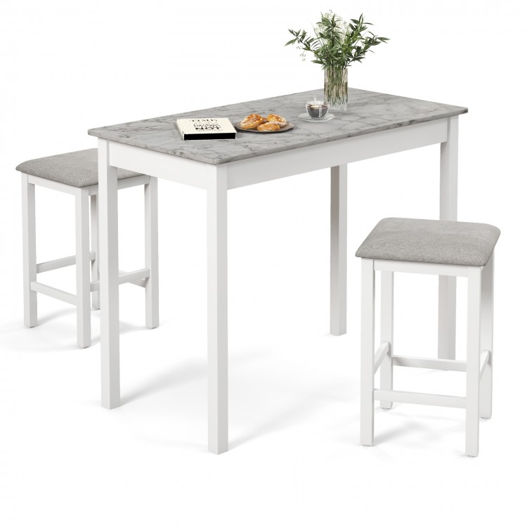3-piece bar table set featuring a faux marble tabletop and two padded stools, ideal for dining or breakfast at home.