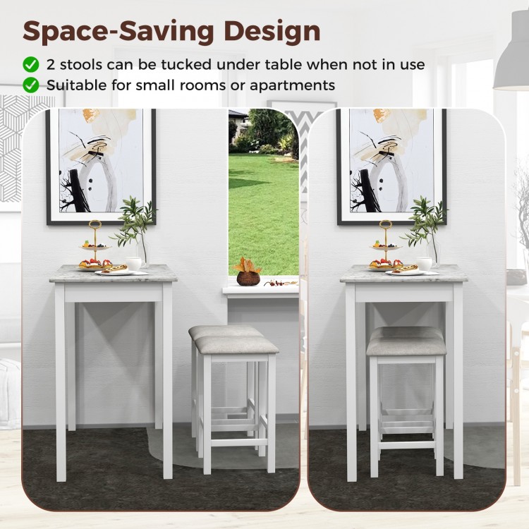 3-piece white bar table set with faux marble top and 2 padded stools, ideal for small spaces and dining.