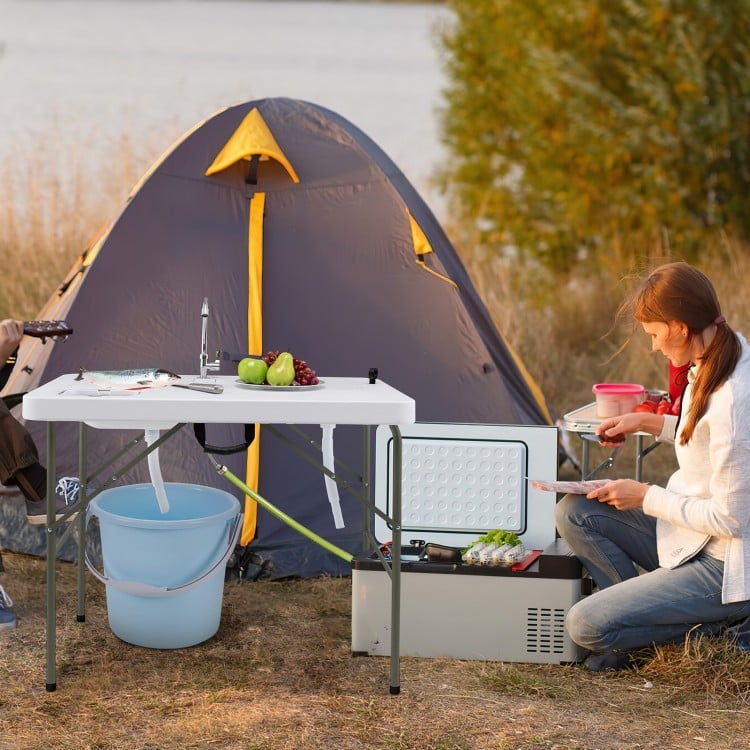 Fish cleaning table with two sinks, sturdy steel frame, and 360° rotating faucet, ideal for outdoor cooking.