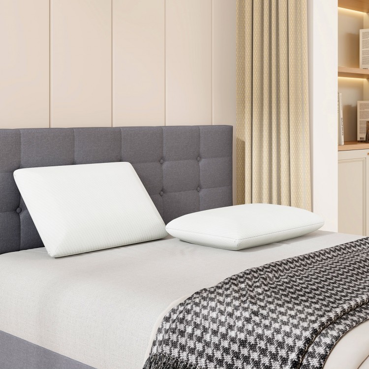 Bamboo charcoal memory foam pillows on a bed, providing pain relief and tailored support for all sleeping positions.