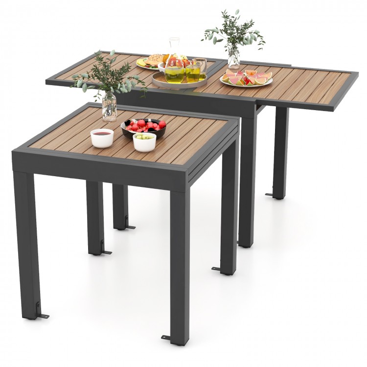 Extendable patio table with a wood-like texture, accommodating 4-6 people, featuring a modern aluminum design.