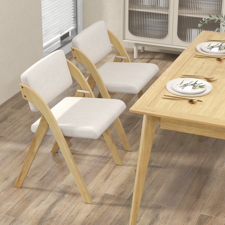 Set of 2 folding kitchen dining chairs with natural rubber wood legs and padded polyester seats for versatile home use.