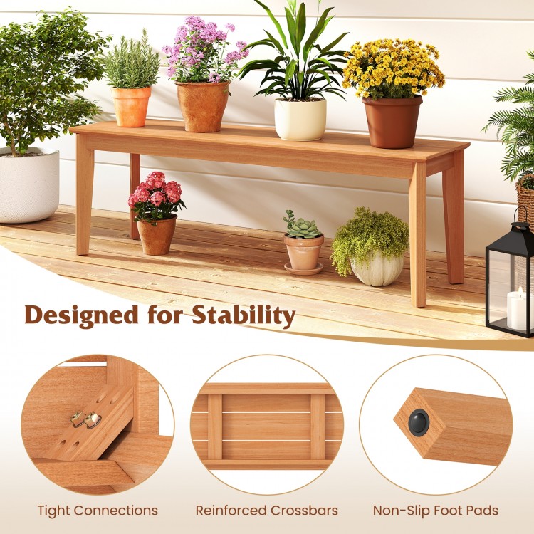 Teak wood bench with reinforced crossbars, designed for stability, perfect for outdoor patio seating.