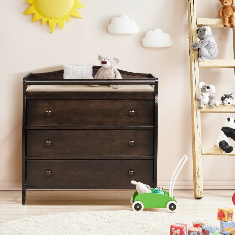 Brown baby changing table with three drawers and safety belt, perfect for diaper changing and storing baby products.