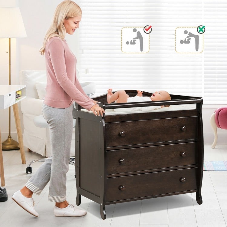 Brown baby changing table with three drawers and safety belt, designed for convenience and stability during diaper.