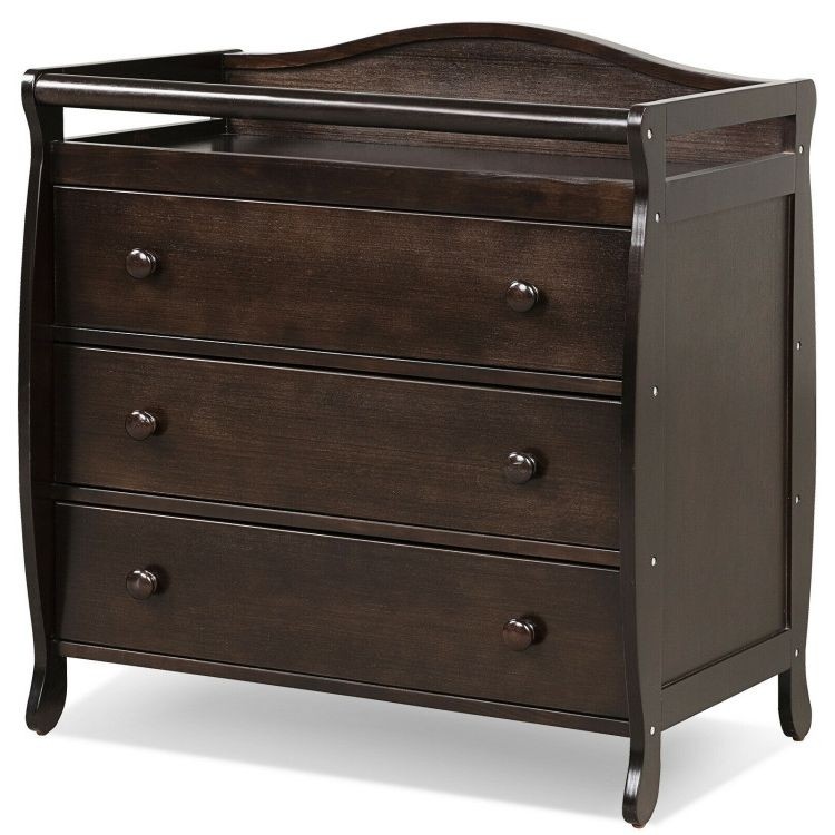 Brown baby changing table with three drawers, safety belt, and wide changing top for convenient diapering and storage.