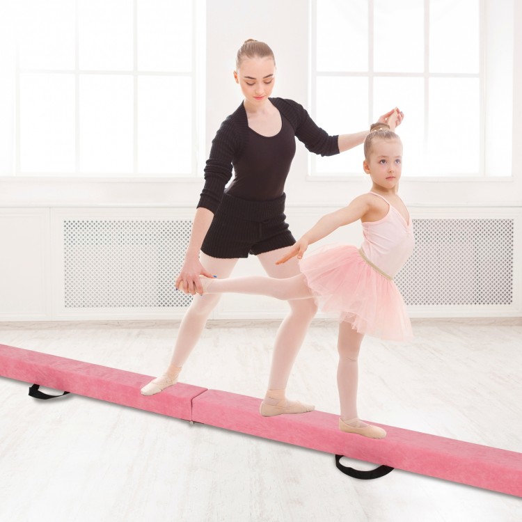 Two young gymnasts practicing on a 9 FT pink folding balance beam with a sturdy pine wood frame for enhanced stability.
