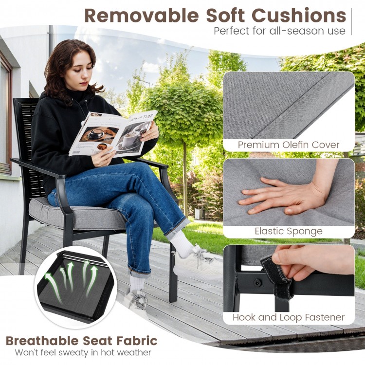 Stackable rattan armchair with removable grey cushions, featuring a breathable seat fabric for comfortable outdoor use.