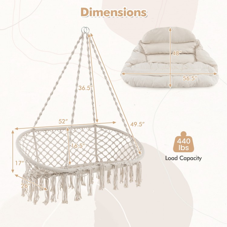 Hand-woven rope hanging chair in beige with thick cushion, featuring elegant tassels and a sturdy folding metal frame.