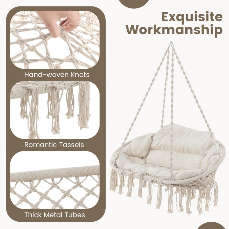 Hand-woven rope hanging chair in beige with thick cushion, featuring romantic tassels and sturdy metal frame for.