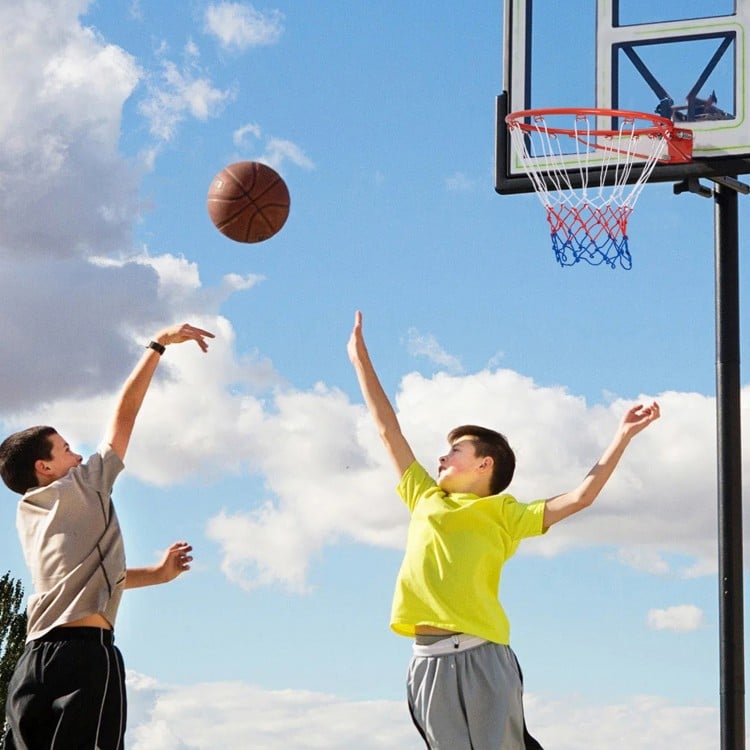 18-inch basketball rim with all-weather net, shown in use outdoors for versatile play and easy installation.