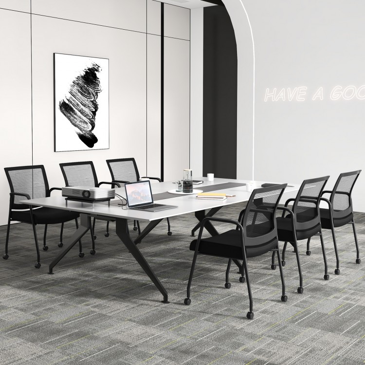 Black office guest chairs on wheels with metal frame, ergonomic design, and mesh backrest, ideal for meeting rooms.