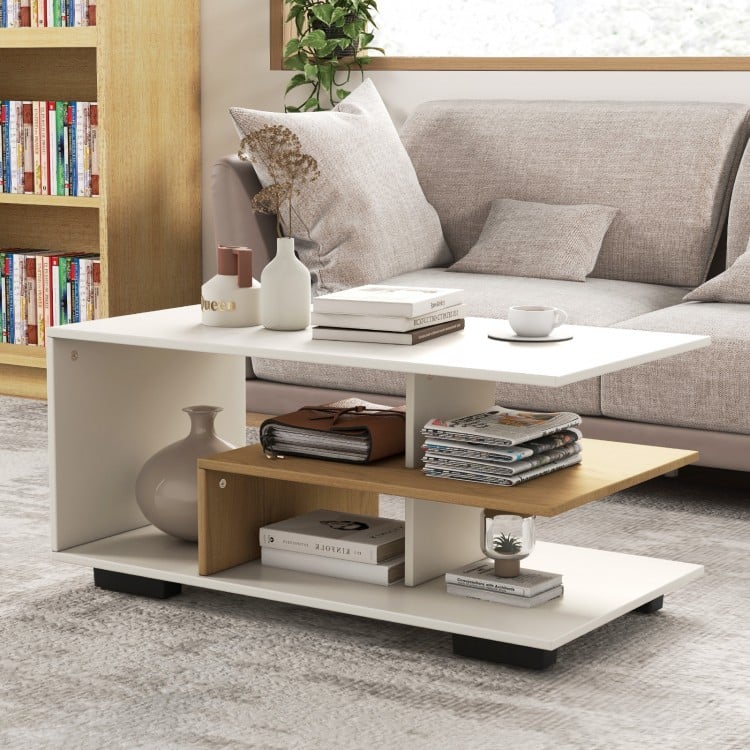 Rectangular coffee table with L-shaped middle shelf in white, featuring 3 tiers for storage and a geometric design.